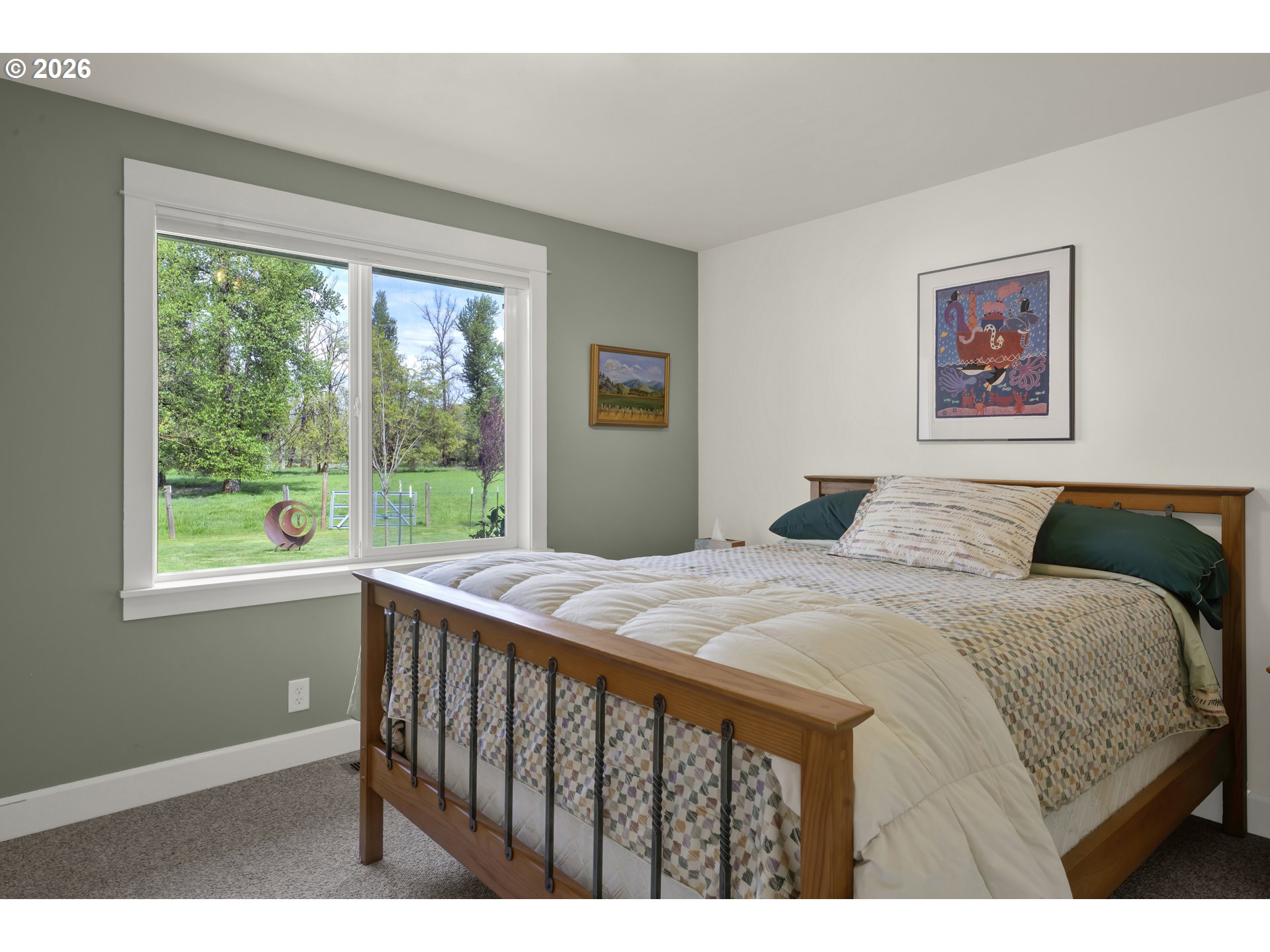 7924 Thurston Road Springfield, OR 97478 - Photo 29 of 45 a bedroom with a bed painting on wall and a large window