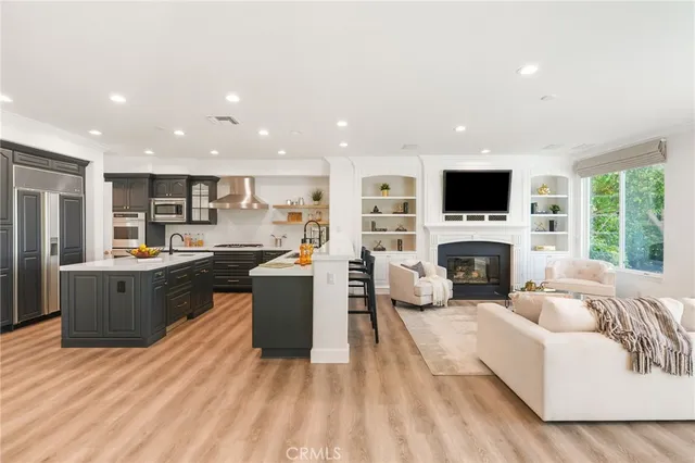 a kitchen with a refrigerator and a sink