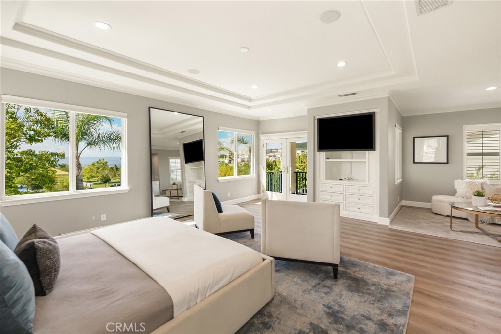 20112 Vía Cellini Porter Ranch, CA 91326 - Photo 31 of 64 a bedroom with a large bed and a flat screen tv