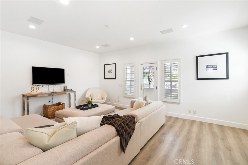 20112 Vía Cellini Porter Ranch, CA 91326 - Photo 36 of 64 a living room with furniture and a flat screen tv
