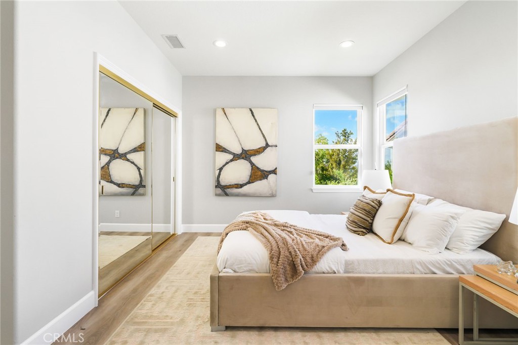 20112 Vía Cellini Porter Ranch, CA 91326 - Photo 39 of 64 a bedroom with a bed and a window