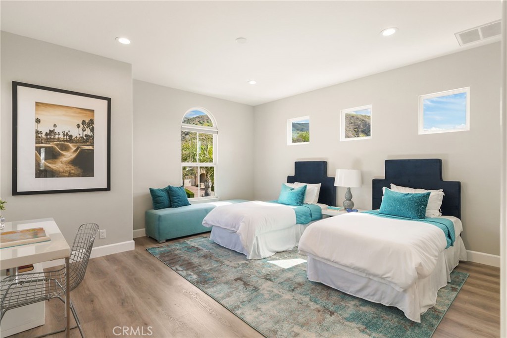 20112 Vía Cellini Porter Ranch, CA 91326 - Photo 42 of 64 a bedroom with two beds and a couch