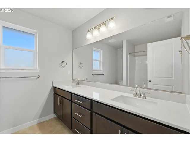 a bathroom with a bathtub a toilet and a shower