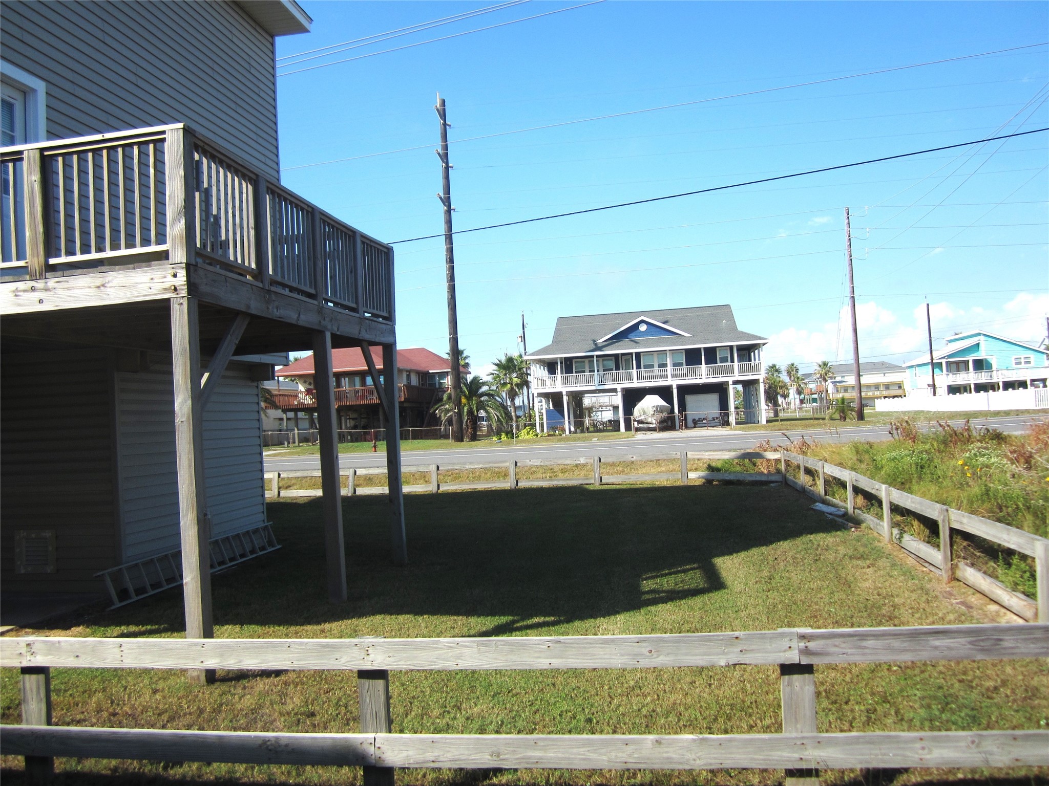 21639 Termini-San Luis Pass Road Galveston, TX 77554 - Photo 2 of 33 Side yard has plenty of room to park for yourselves and guests