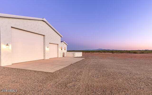 6233 West Airport Road Willcox, AZ 85643 - Photo 5 of 54 a view of a big room with a lake and mountain view