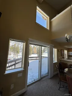 a view of a livingroom with furniture and windows
