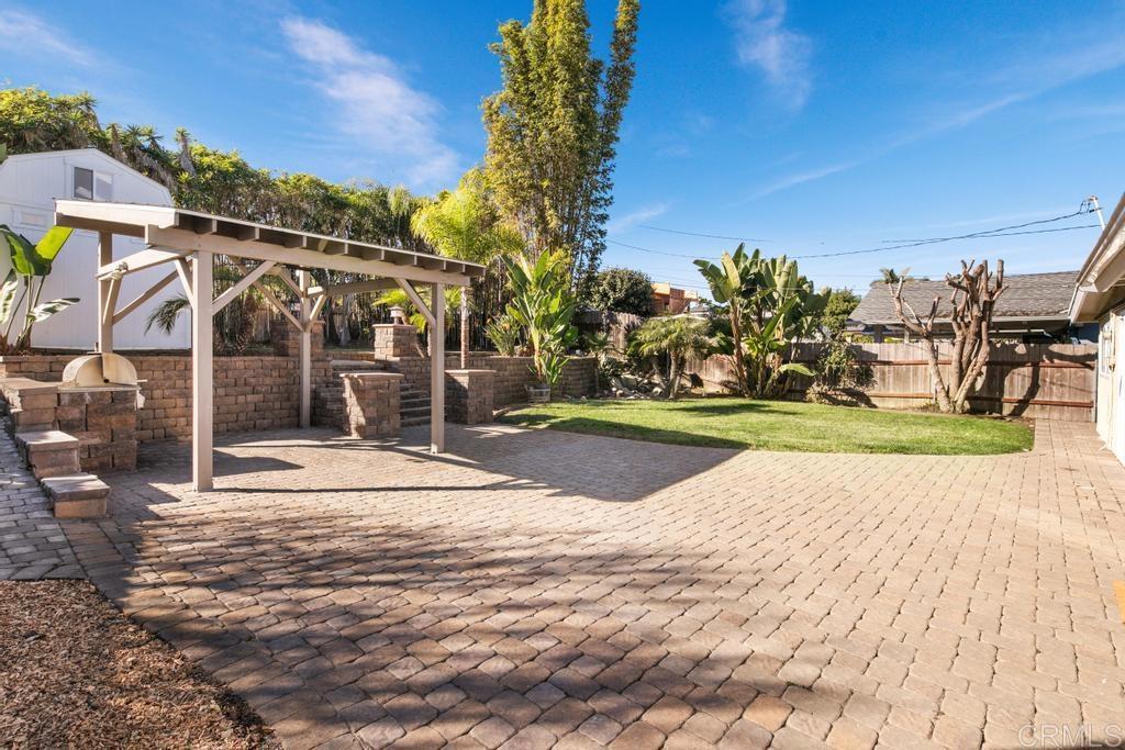 5199 El Arbol Drive Carlsbad, CA 92008 - Photo 11 of 57 EXPANSIVE PAVER PATIO AND OOVERRED PERGOLA, WHAT AN AMAZING BACKYARD