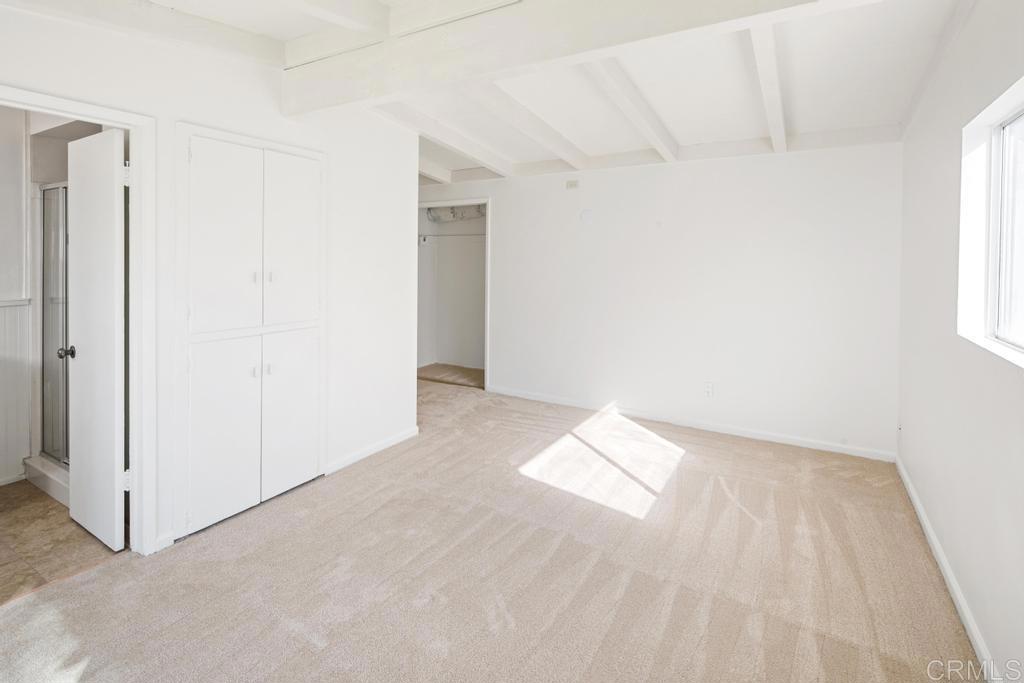 5199 El Arbol Drive Carlsbad, CA 92008 - Photo 22 of 57 Master bedroom with South facing window, slider to patio and 2 closets.