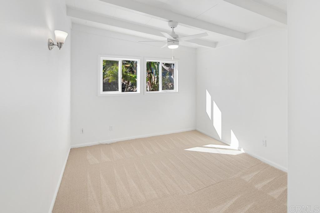 5199 El Arbol Drive Carlsbad, CA 92008 - Photo 27 of 57 Bedroom 1 with new carpet, paint and fan.