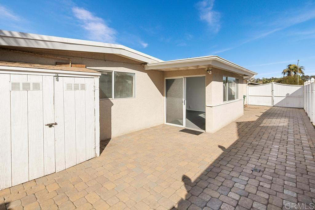 5199 El Arbol Drive Carlsbad, CA 92008 - Photo 30 of 57 View of sideyard area and bonus small RV or boat parking.