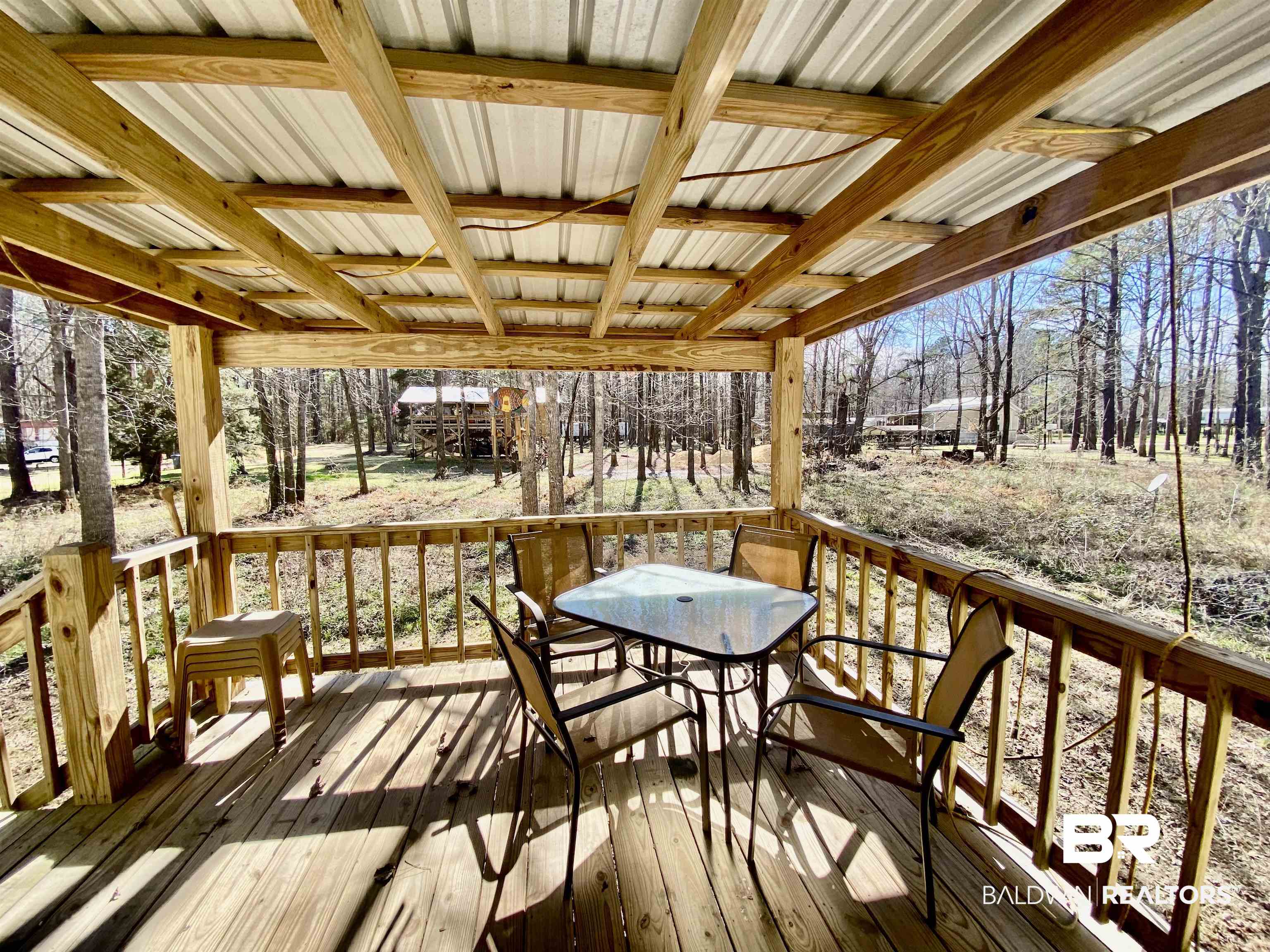 294 Eureka Way Uriah, AL 36480 - Photo 15 of 18 Wooden deck featuring outdoor dining area