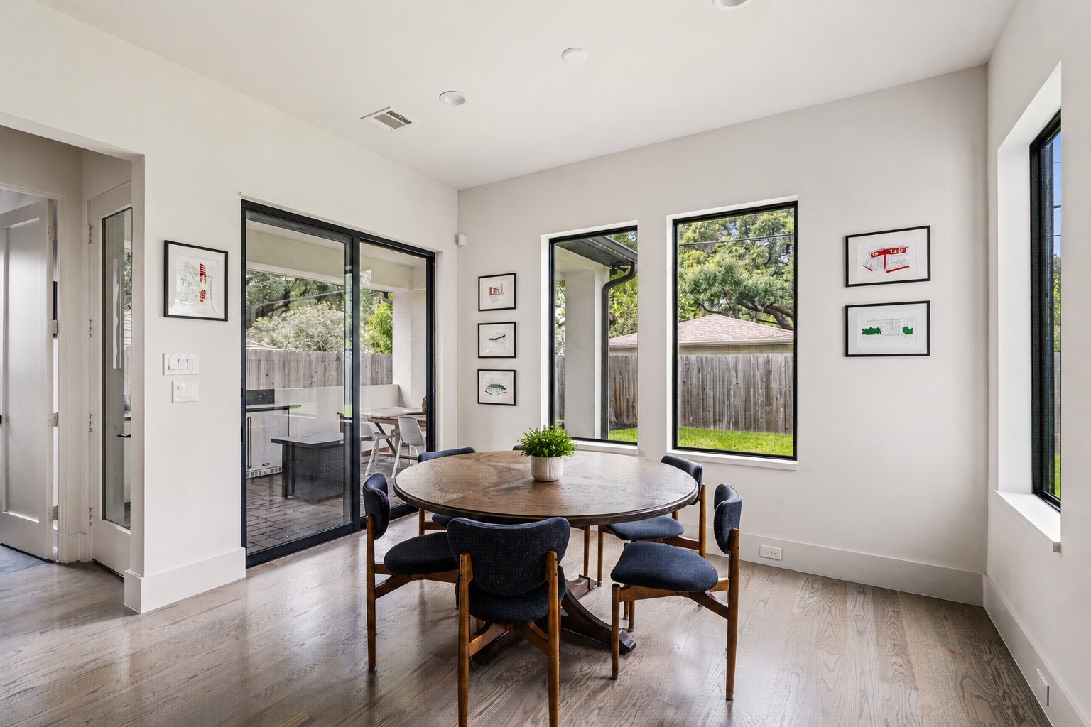 4638 Merwin Street Houston, TX 77027 - Photo 13 of 42 Conveniently located just off the kitchen, the breakfast area offers easy access to the covered patio and backyard for effortless indoor-outdoor living.