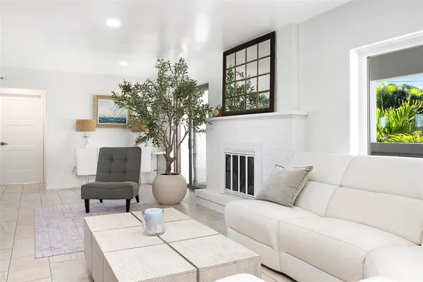 a view of a livingroom with a furniture and a fireplace