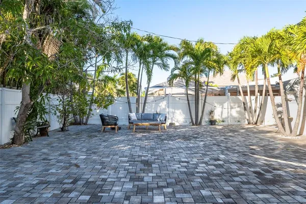 a view of a swimming pool with an outdoor space and seating area