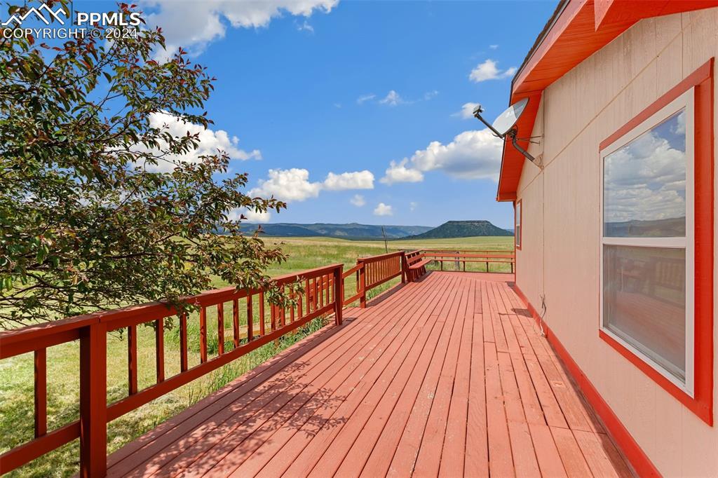 12155 South Mesa View Road Larkspur, CO 80118 - Photo 12 of 16 a view of balcony with wooden floor