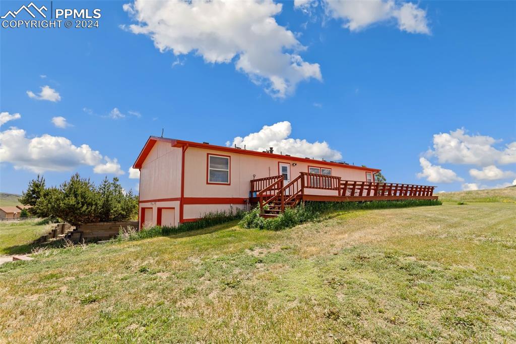 12155 South Mesa View Road Larkspur, CO 80118 - Photo 15 of 16 a view of a backyard of the house