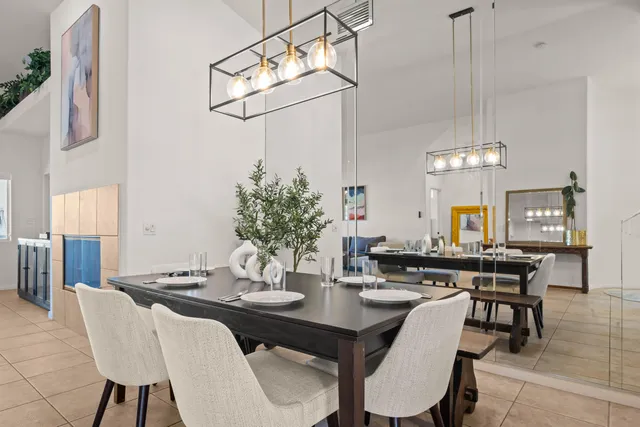 a kitchen with stainless steel appliances granite countertop a sink and dishwasher with white cabinets