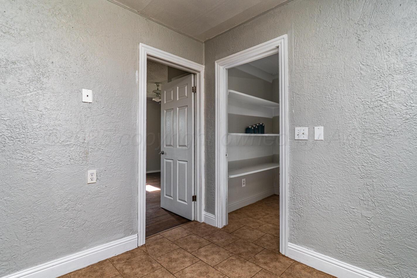 8015 Upton Road Amarillo, TX 79119 - Photo 8 of 16 a view of an empty room and window