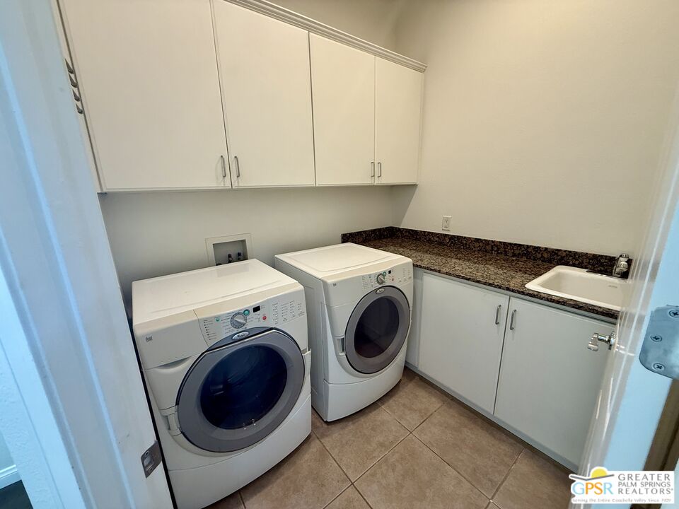 26 Bollinger Road Rancho Mirage, CA 92270 - Photo 11 of 15 a utility room with dryer and washer