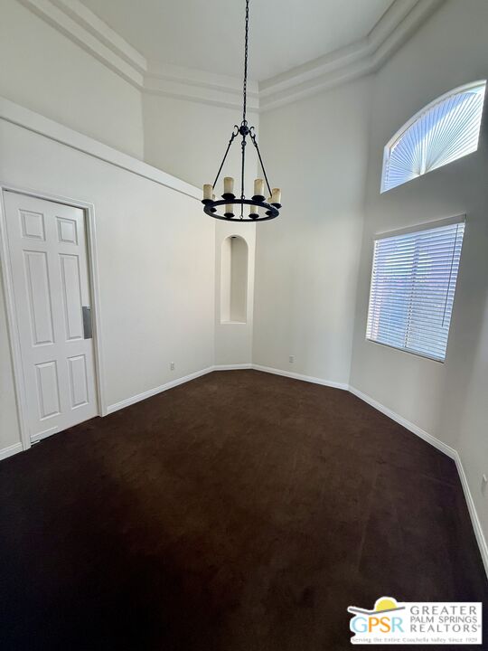 26 Bollinger Road Rancho Mirage, CA 92270 - Photo 5 of 15 a front view of a house with a space