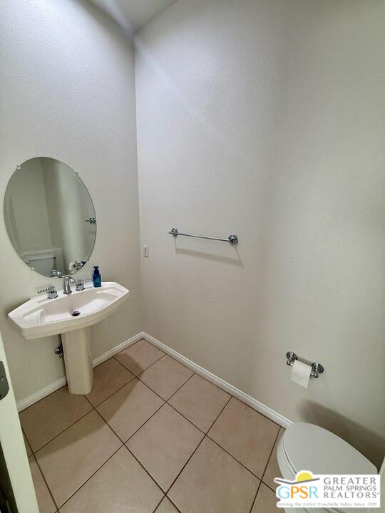 26 Bollinger Road Rancho Mirage, CA 92270 - Photo 7 of 15 a bathroom with a sink a toilet and mirror