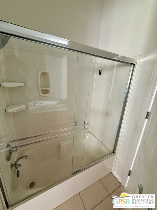 26 Bollinger Road Rancho Mirage, CA 92270 - Photo 10 of 15 a bathroom with a shower and a glass door