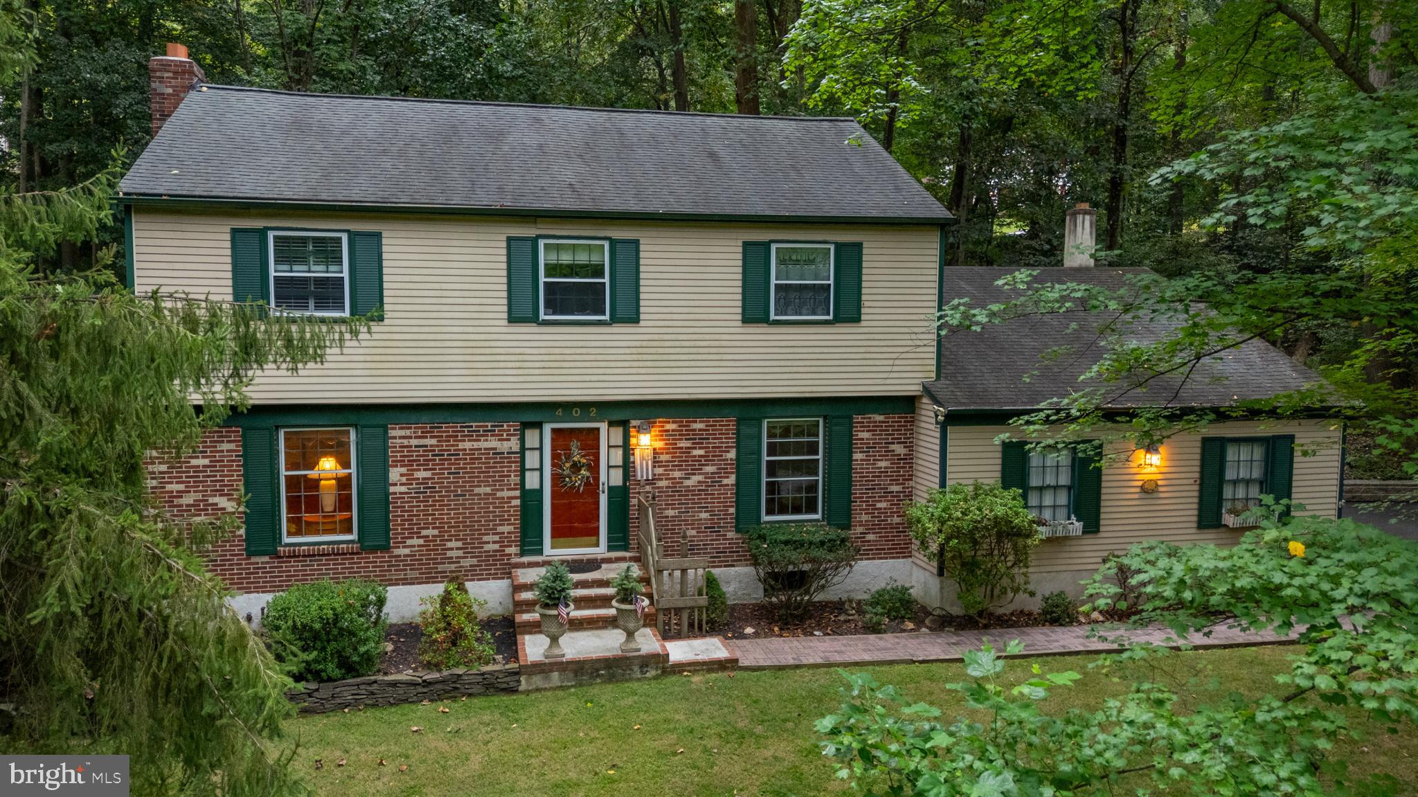 402 Norwood Road Downingtown, PA 19335 - Photo 1 of 32 a front view of a house with garden