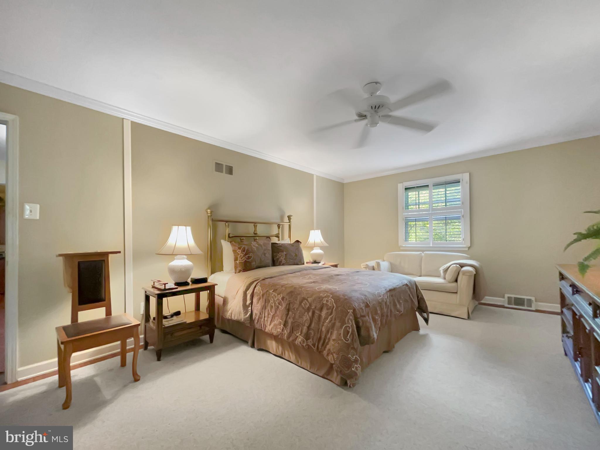 402 Norwood Road Downingtown, PA 19335 - Photo 17 of 32 a bedroom with a bed and a chandelier