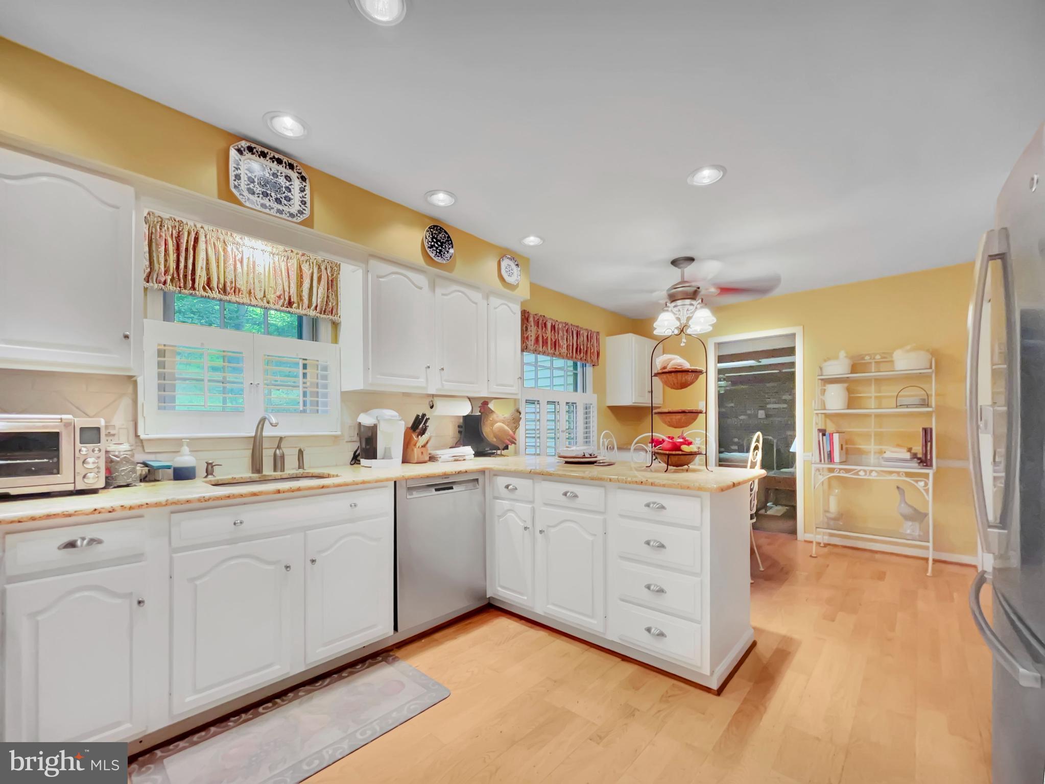 402 Norwood Road Downingtown, PA 19335 - Photo 3 of 32 a kitchen that has a lot of cabinets and wooden floor