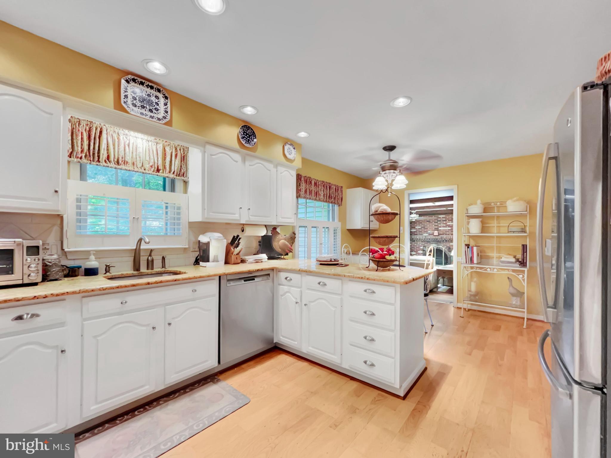 402 Norwood Road Downingtown, PA 19335 - Photo 4 of 32 a kitchen with sink cabinets and window