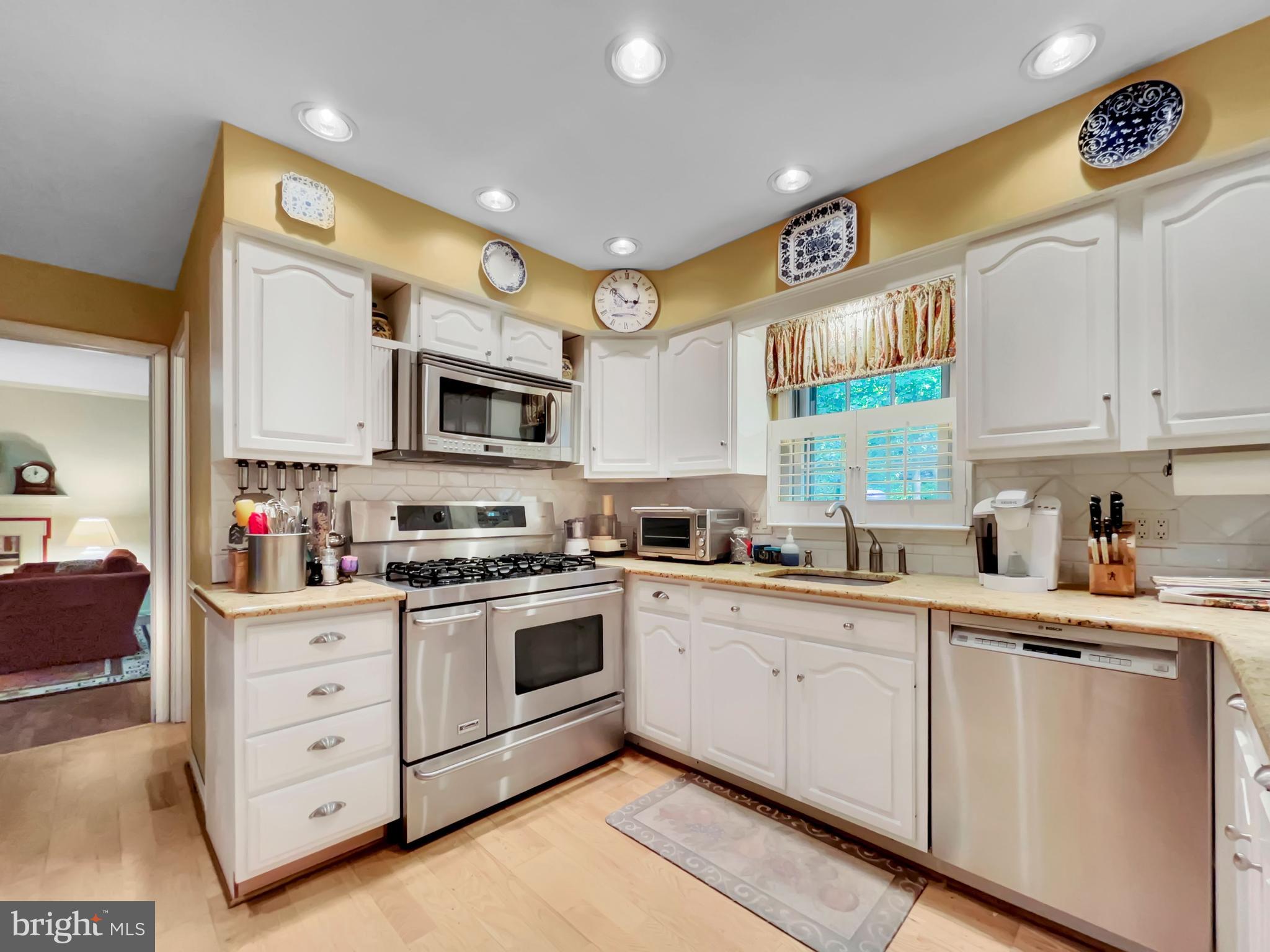402 Norwood Road Downingtown, PA 19335 - Photo 5 of 32 a kitchen with granite countertop cabinets stainless steel appliances and a sink
