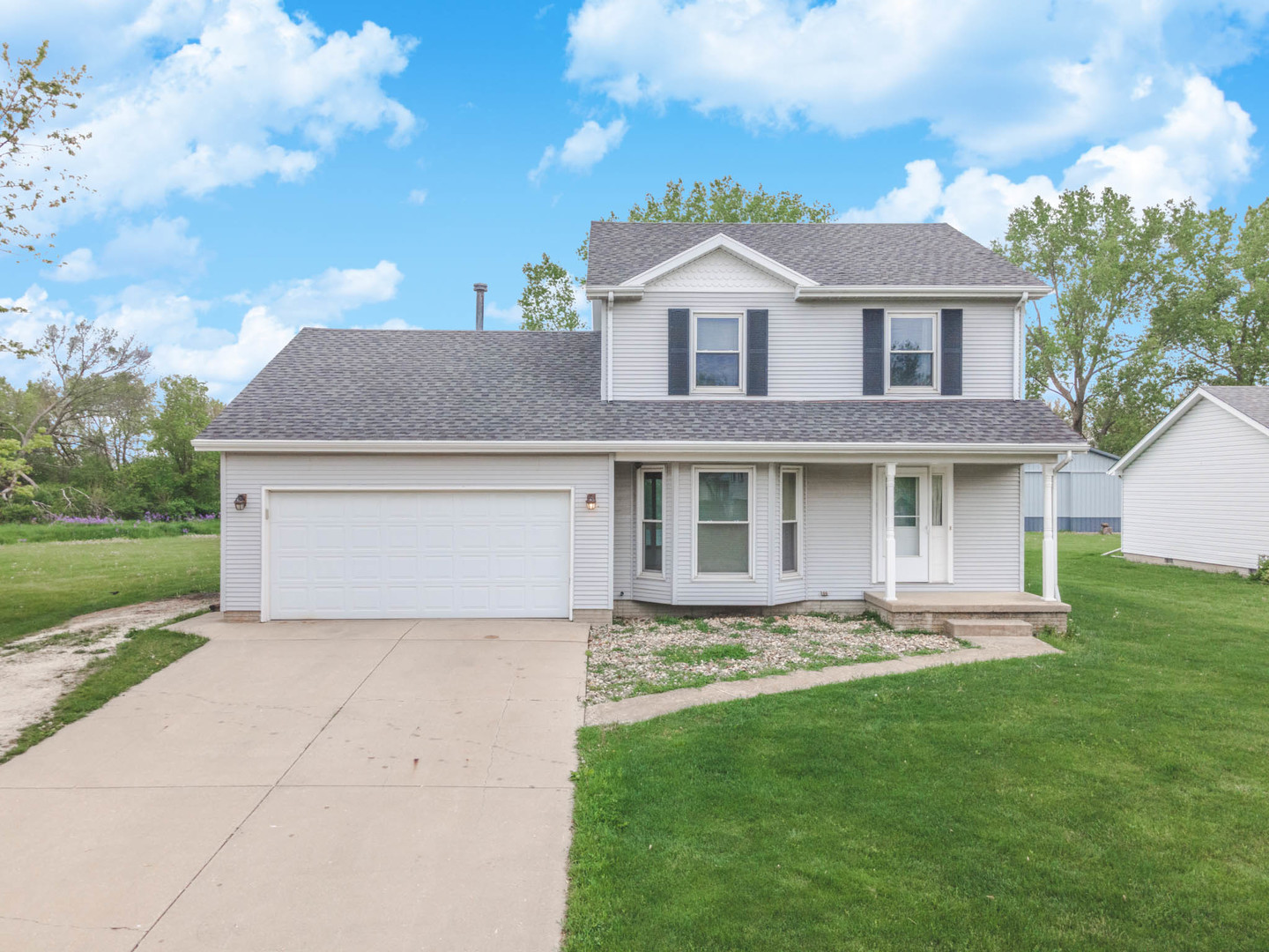 130 Morgan Street Dwight, IL 60420 - Photo 1 of 33 a front view of a house with a garden