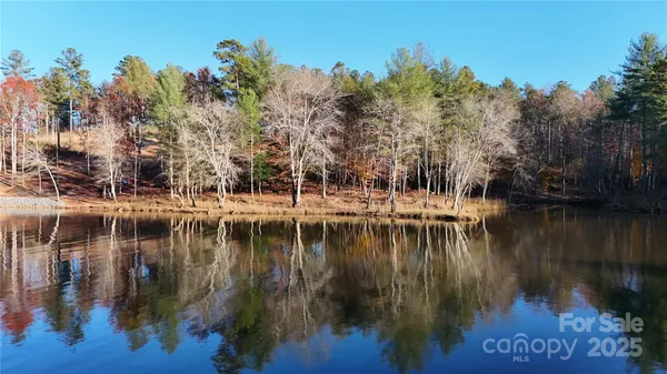 a view of water pond with outdoor seating