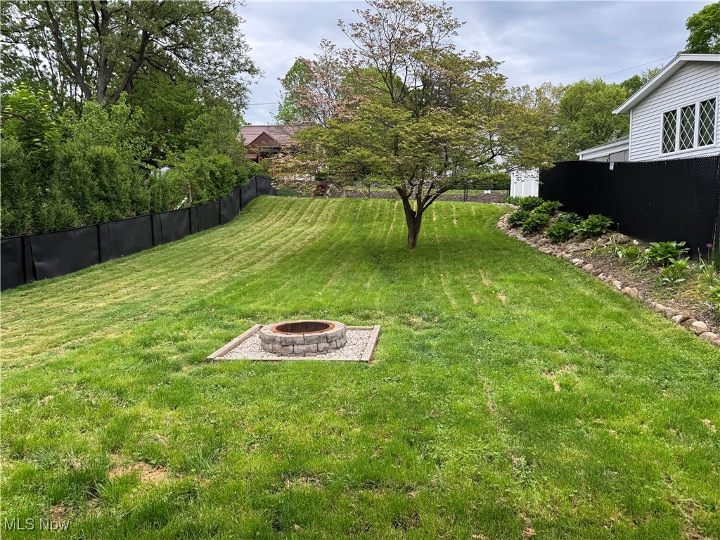 1139 Kessel Avenue Akron, OH 44310 - Photo 32 of 36 View of yard featuring an outdoor fire pit