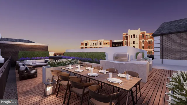 a view of a patio with couches table and chairs with wooden floor and fence