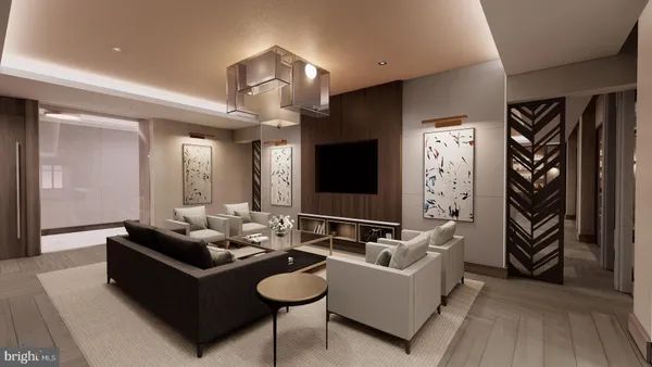 a living room with furniture and wooden floor