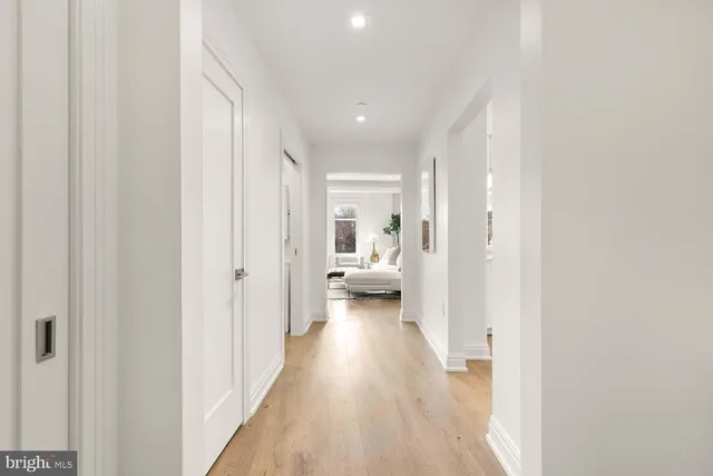 a kitchen with white cabinets and a stove