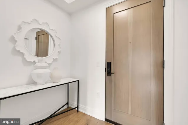 a room with counter top and chandelier