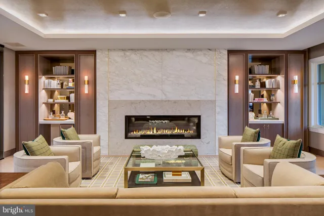 a living room with furniture and natural light