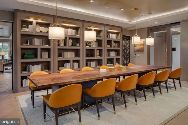 a view of a living room with furniture and wooden floor