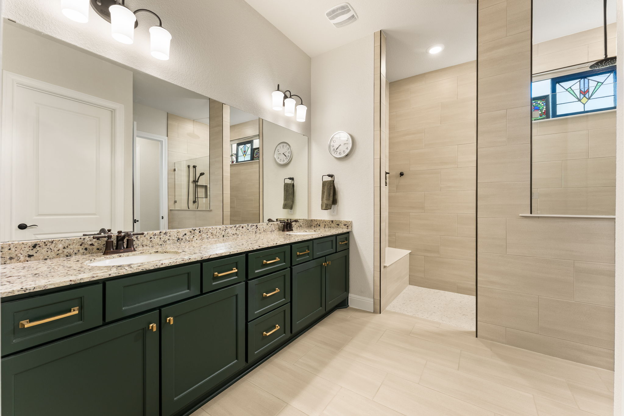 112 Telegraph Lane Georgetown, TX 78633 - Photo 5 of 35 The stylish primary bath also features many upgrades, including a large shower with a bench, rain shower head and wand shower head. There are upgraded Crema Pearl granite counters, upgraded Ripe Olive cabinets, and upgraded Persuade Beige and Iconic Cape Gray tile. The upgraded 12x24 floor tile is Persuade Beige.