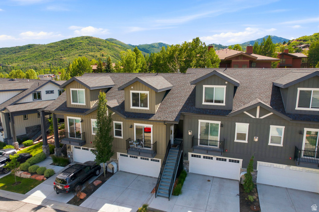 3355 Santa Fe Road Park City, UT 84098 - Photo 38 of 45 Modern townhome exterior featuring dormer windows, individual balconies with black railings, and attached two-car garages