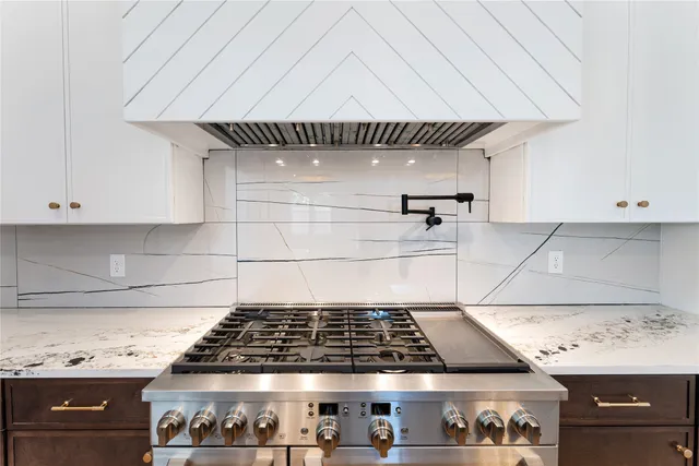 a close view of a stove a microwave and cabinets in a kitchen