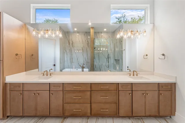 a spacious bathroom with a double vanity sink mirror and double