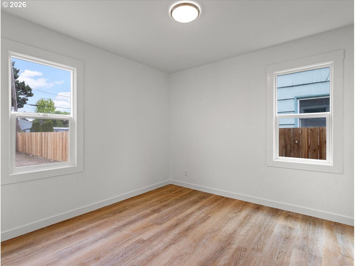 440 25th Avenue Longview, WA 98632 - Photo 9 of 27 a view of empty room with wooden floor and fan
