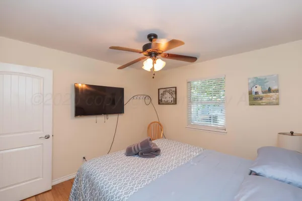 a view of a house with a yard and pathway