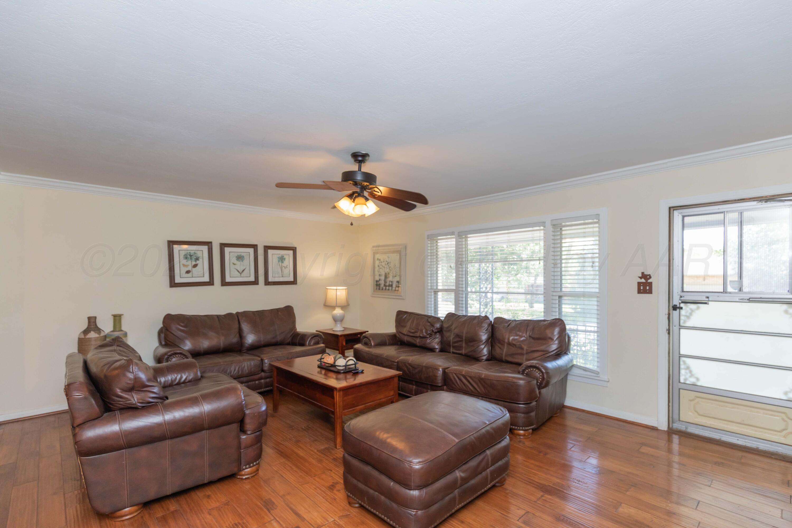 Amarillo Sunset Portfolio Amarillo, TX 79109 - Photo 236 of 279 a living room with furniture a ceiling fan and a window