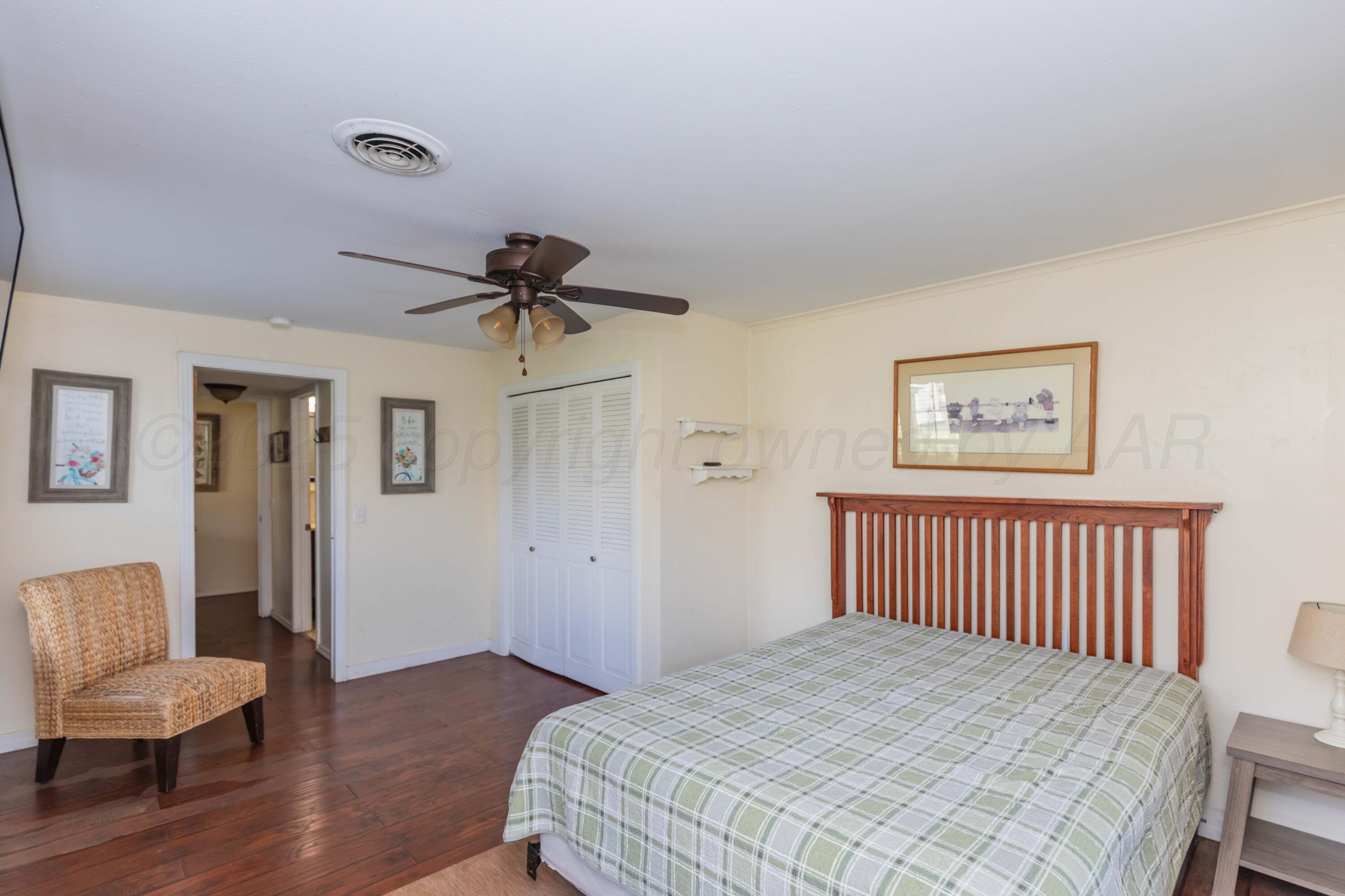 Amarillo Sunset Portfolio Amarillo, TX 79109 - Photo 253 of 279 a bedroom with a bed and a chair