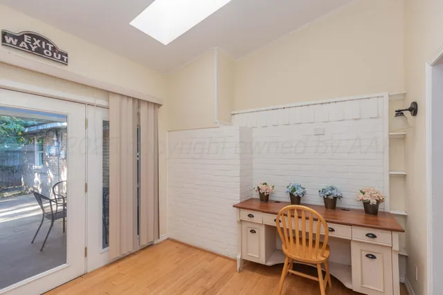a living room with furniture a ceiling fan and a window