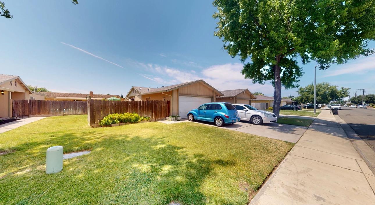1645 Moffett Road Ceres, CA 95307 - Photo 7 of 11 a house view with swimming pool and trees in the background